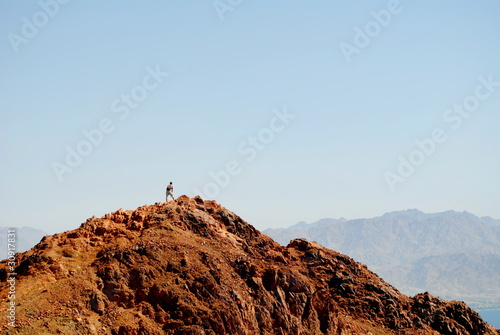 the man on top of a hill