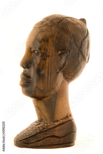 African statuette of a woman isolated on white background
