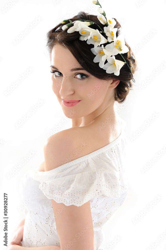 Beautiful spring woman with pure skin and flowers in her hair Beautiful spring woman with pure skin and flowers in her hair