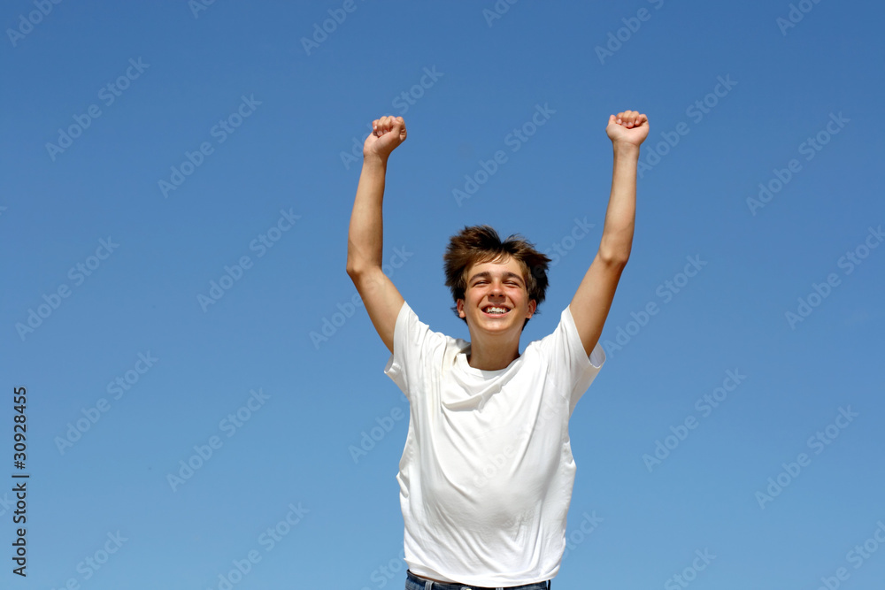 happy teenager running on blue sky background happy teenager running on blue sky background
