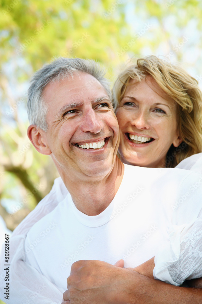 Mature couple smiling and embracing