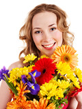 Young woman holding flowers.