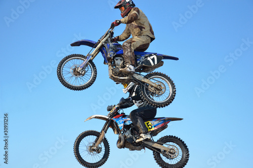 Fototapeta Naklejka Na Ścianę i Meble -  motocross rider jump, blue sky