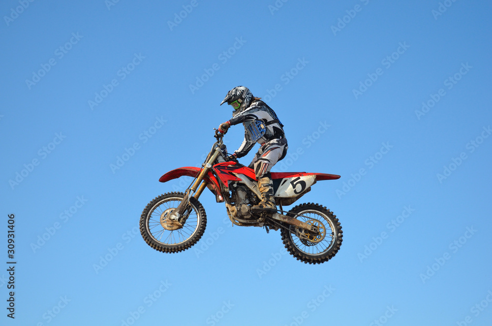 Russia, Samara, motocross rider jump, blue sky Russia, Samara, motocross rider jump, blue sky