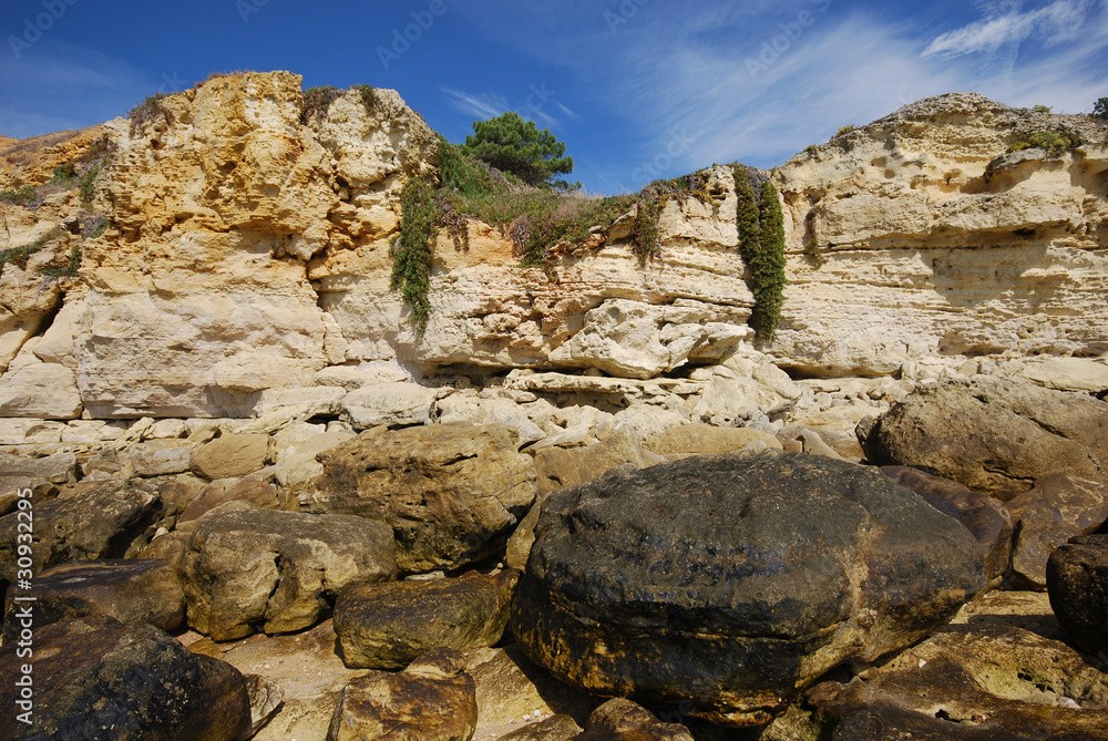 red cliffs and coastline stones (Algarve, Portugal)