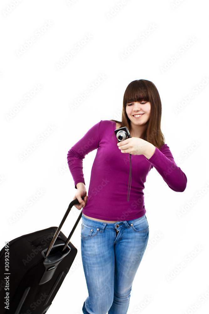 Young woman going on vacation with camera and her suitcase. Young woman going on vacation with camera and her suitcase.