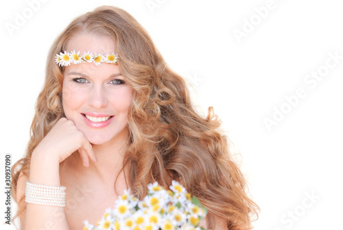 spring or summer woman with camomile flowers and long hair photo