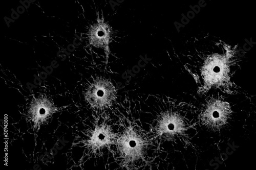 Valokuvatapetti Broken glass - bullet holes isolated on black