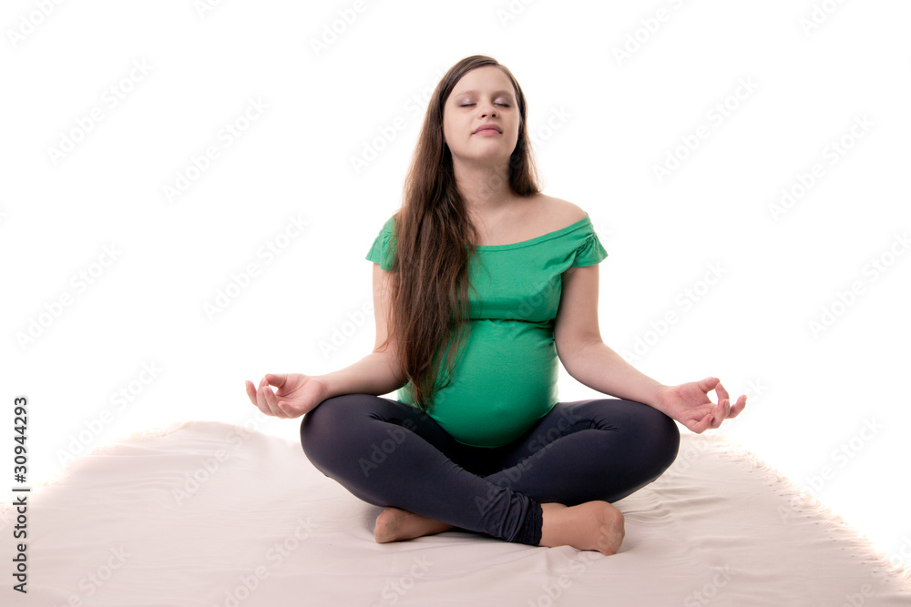 Pregnant woman doing yoga Pregnant woman doing yoga