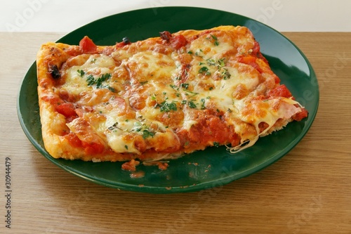pizza with tomatoes and mozarella cheese