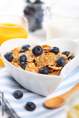 healthy breakfast- cereal with fresh blueberries, juice and milk