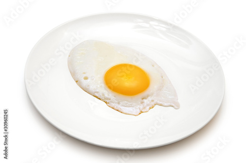 one sunny side up egg on white plate isolated