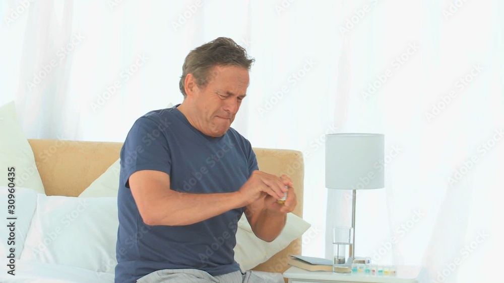 Elderly man having a huge headache Elderly man having a huge headache