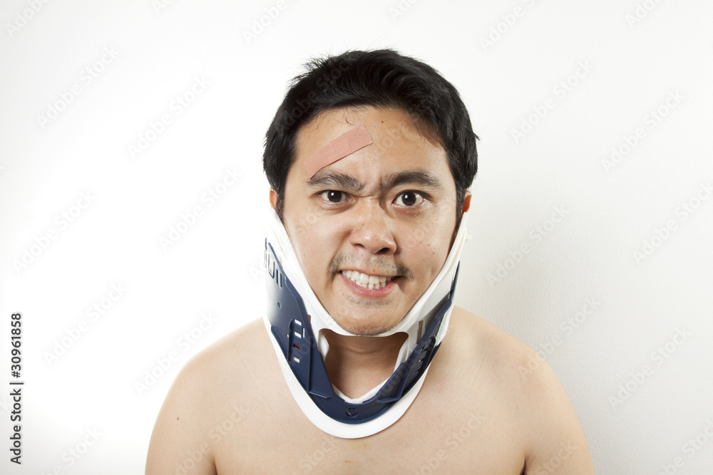 It's hurt, A man using hard collar to cure neck pain. It's hurt, A man using hard collar to cure neck pain.
