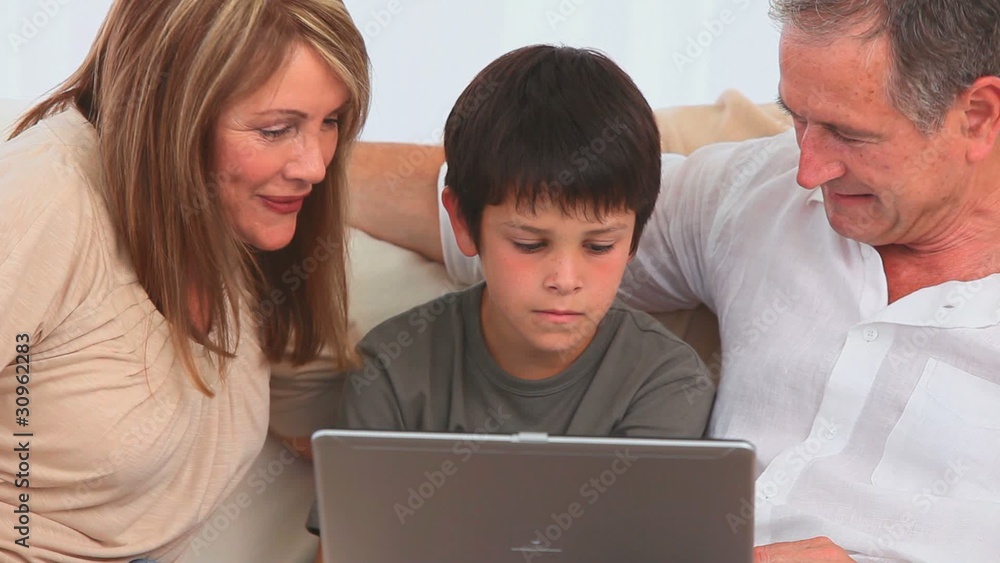 Grandparents and their grandson playing a game Grandparents and their grandson playing a game