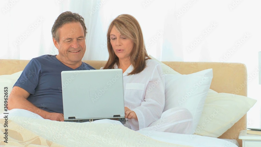 Retired couple using a laptop Retired couple using a laptop