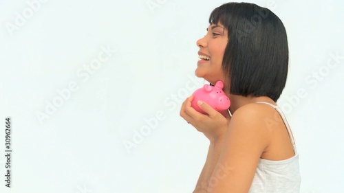 Attractive asian woman saving money photo