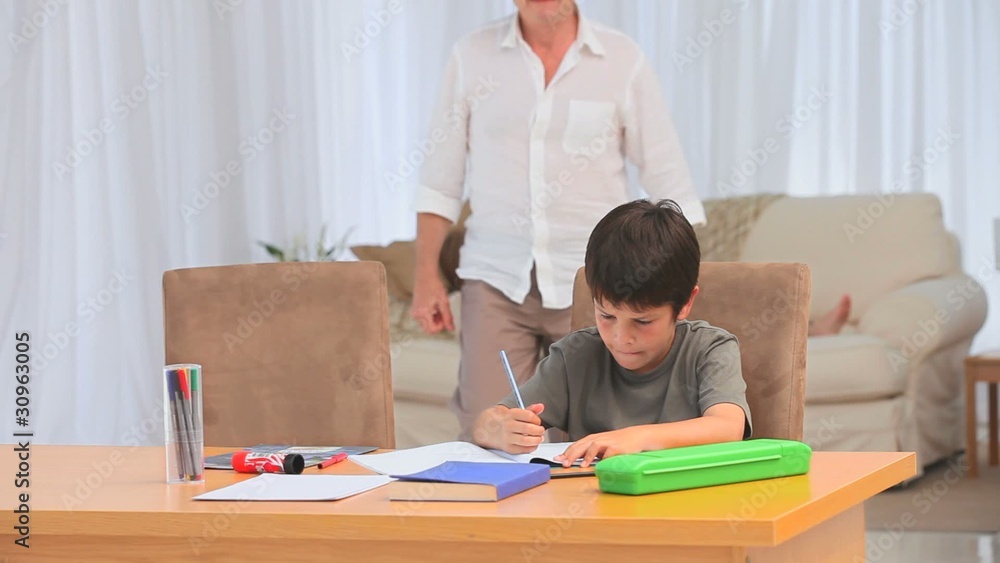 Little child doing his homeworks Little child doing his homeworks