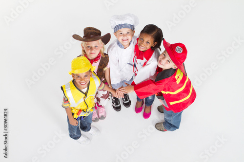Canvas Print kids in various career uniforms looking up