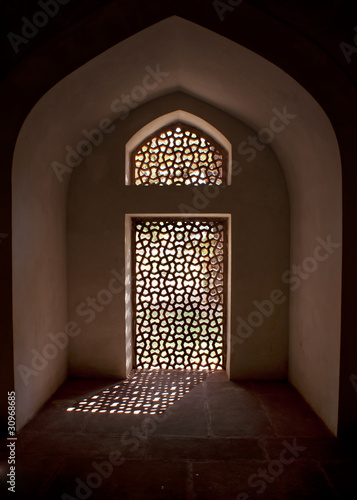 Alcove with stone screen in window at the Humayun tomb.