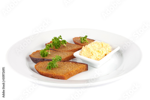 pieces of toasted bread with cheese dip