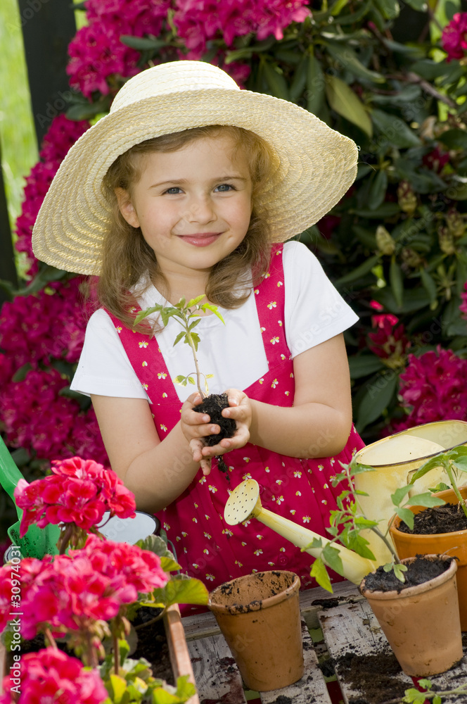 Happy little girl gardener