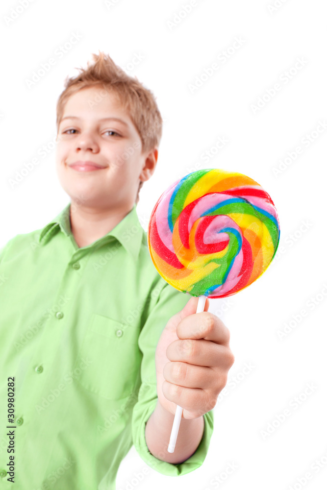 Funny boy holding  lollipop