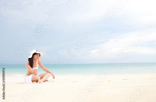 Young fashion woman on the beach