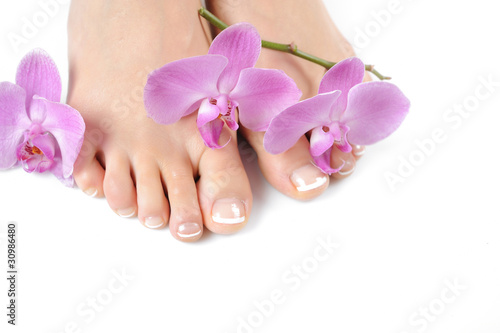 Beautiful feet with perfect spa french nail pedicure.isolated