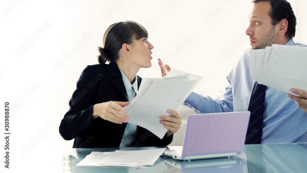 Business man woman arguing in front of the laptop Business man woman arguing in front of the laptop