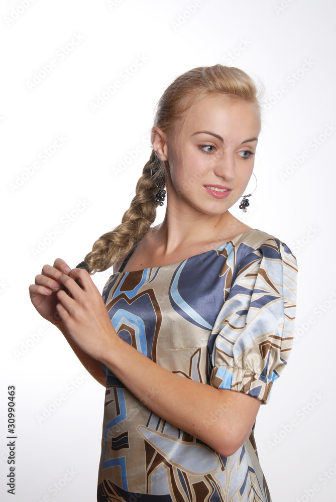 attractive young woman braiding hair attractive young woman braiding hair