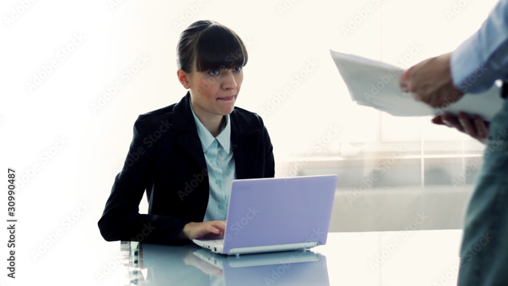 Boss giving office female worker more paperwork Boss giving office female worker more paperwork