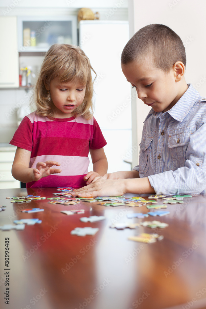 Children, playing puzzles Children, playing puzzles