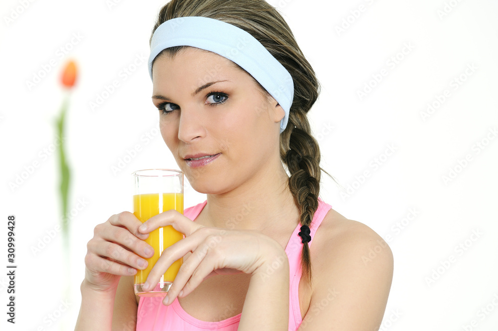 beautiful woman is drinking a fresh orange juice beautiful woman is drinking a fresh orange juice