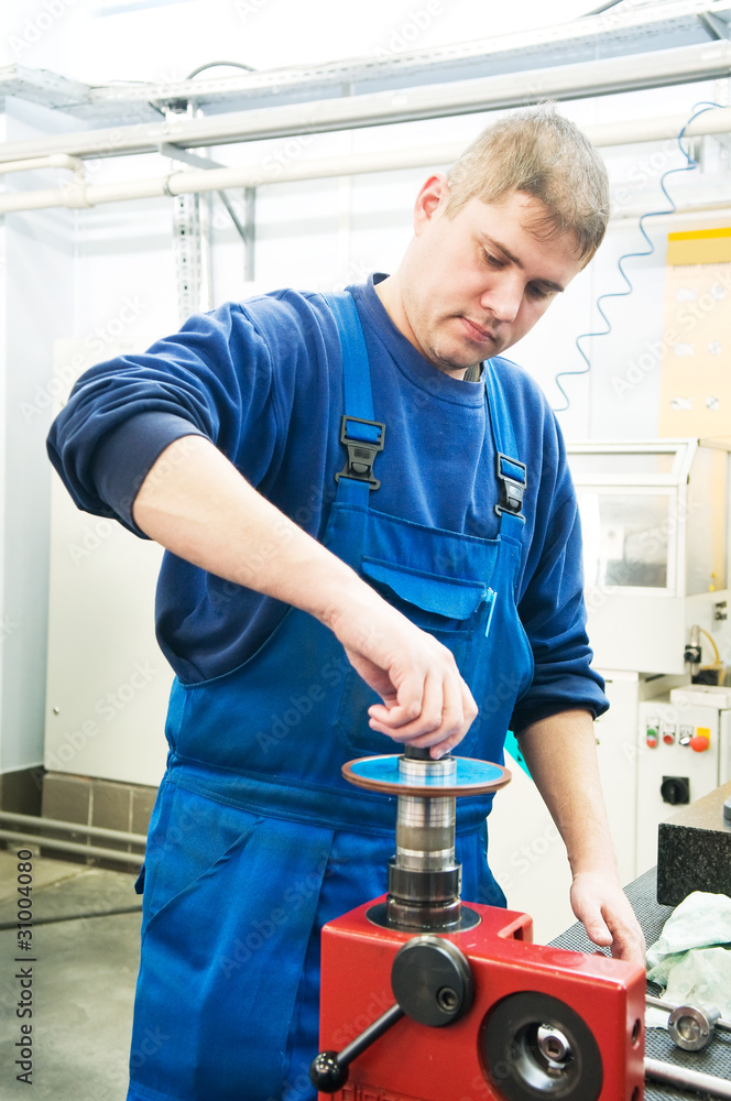 worker installing cutting tool worker installing cutting tool