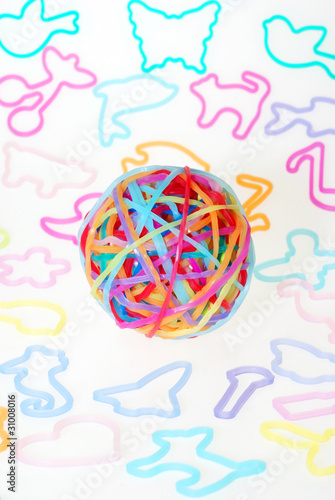 A ball made from colorful silly shaped rubber band bracelets