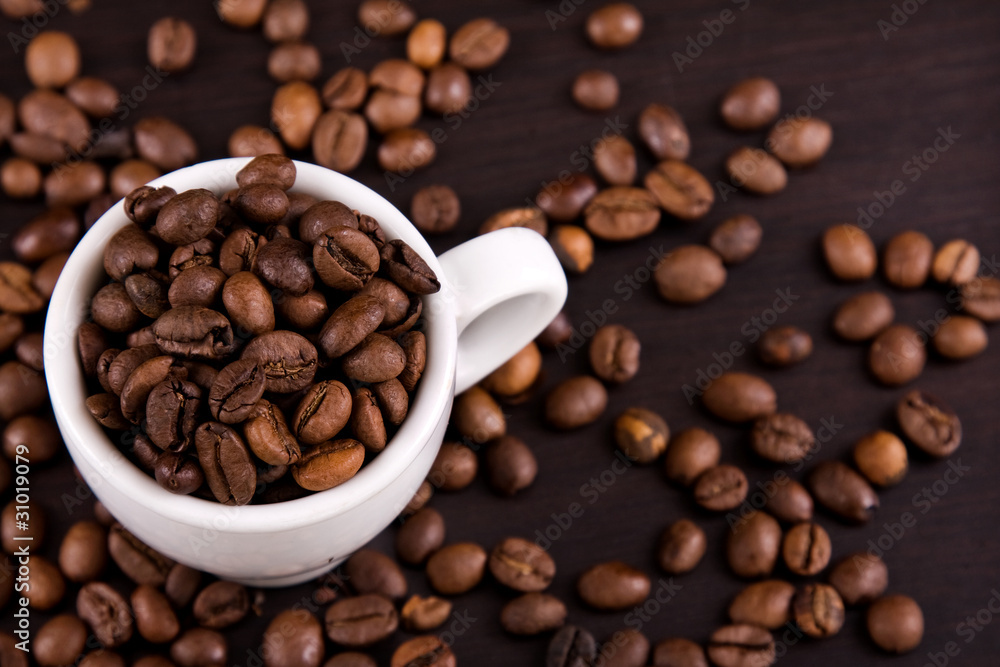 Cup of coffe beans on a table Cup of coffe beans on a table