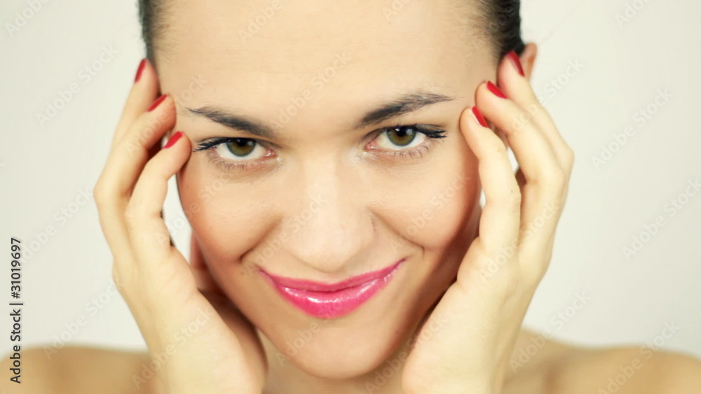 Attractive sexy woman posing and touching her face, isolated Attractive sexy woman posing and touching her face, isolated