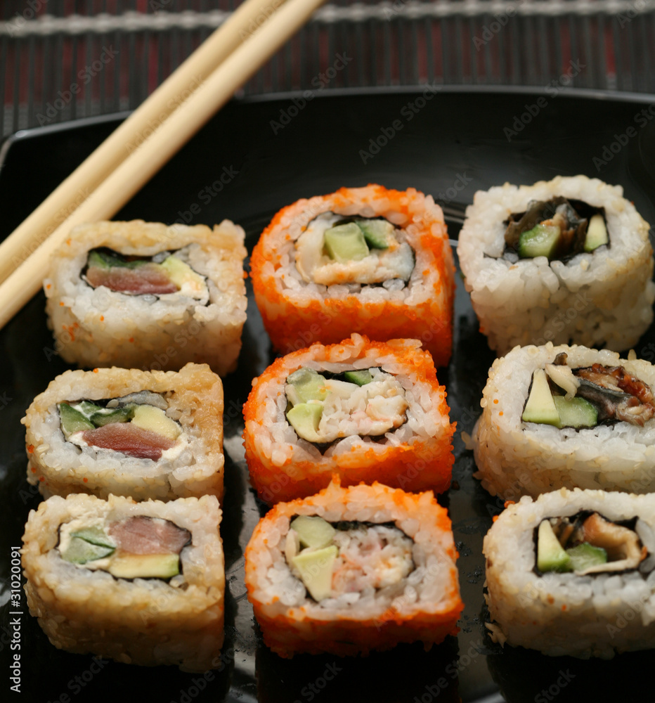 Japanese sushi on black plate Japanese sushi on black plate