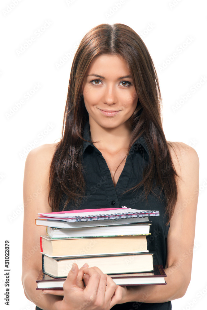 Young woman holding books, notepads in her hands Young woman holding books, notepads in her hands