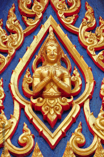 Thai lord Statue on the wall
