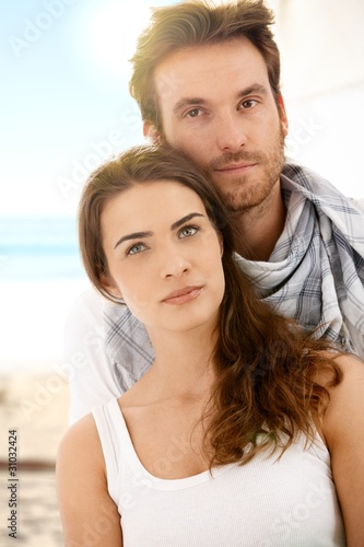 Summer portrait of young couple on beach