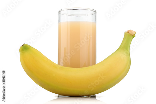 Full glass of banana juice and fruits isolated