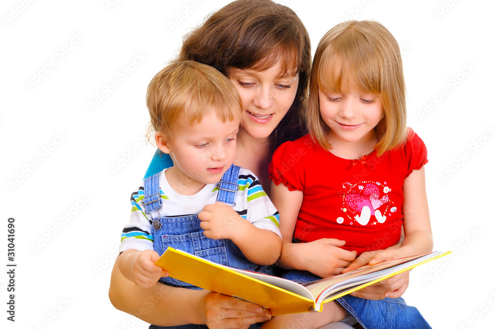 Young mother is reading a book with her kids Young mother is reading a book with her kids