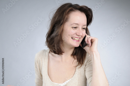 cheerful girl calling by phone