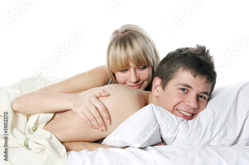 young happy couple in bed