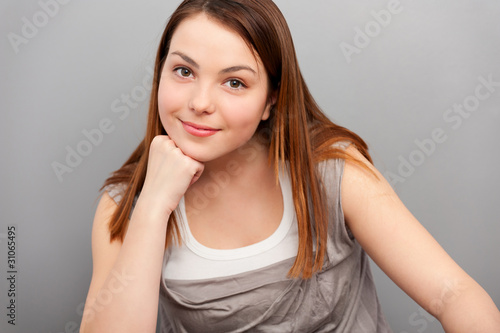 pretty smiley woman over grey background