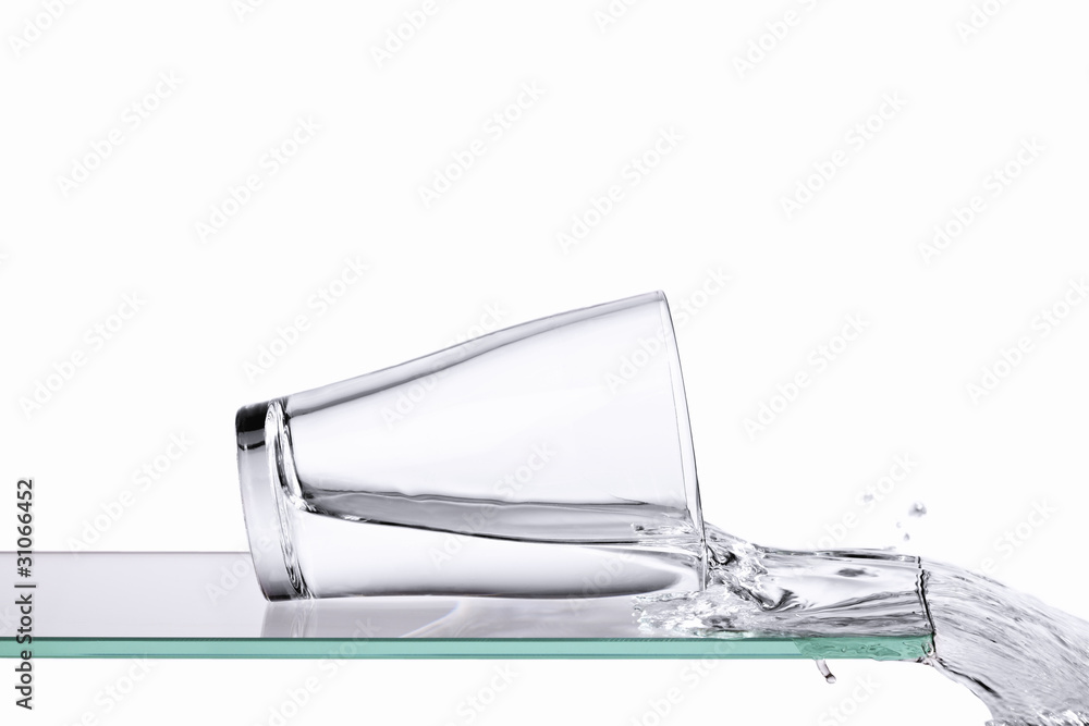 Spilling glass of water Stock Photo | Adobe Stock