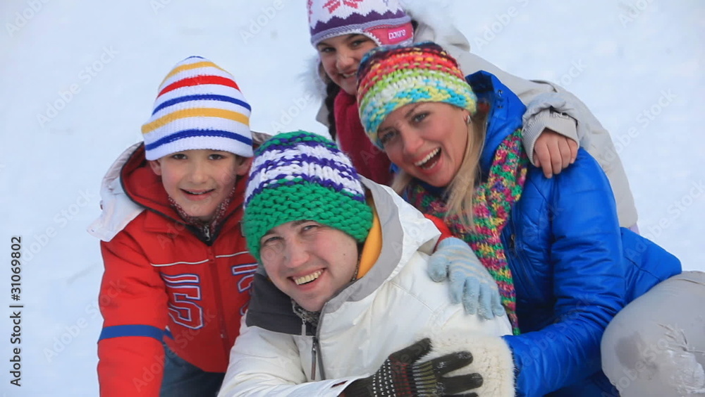 Happy family having fun outside in winter Happy family having fun outside in winter