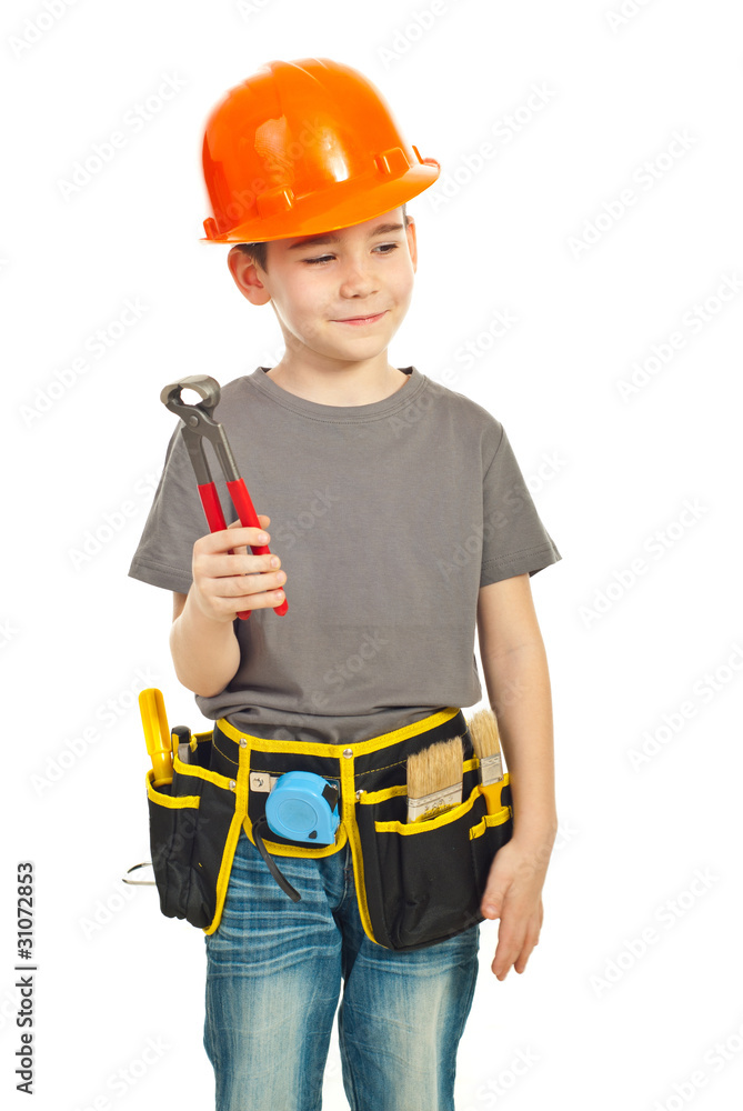Thinking boy holding pincers Thinking boy holding pincers